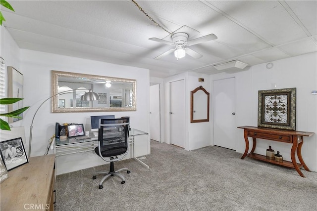 office with carpet floors and a ceiling fan