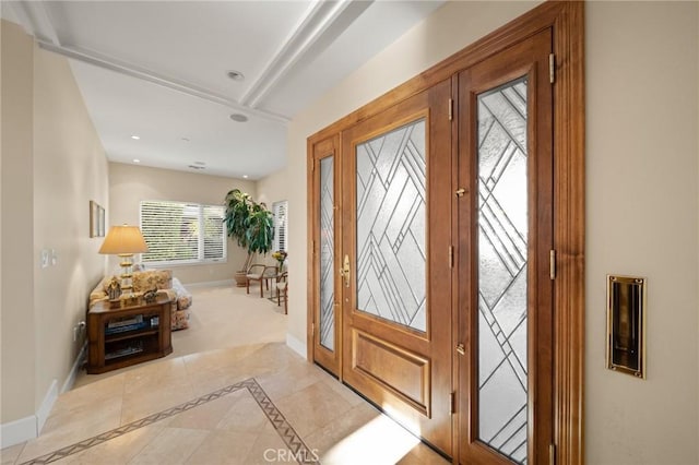 foyer featuring baseboards and recessed lighting