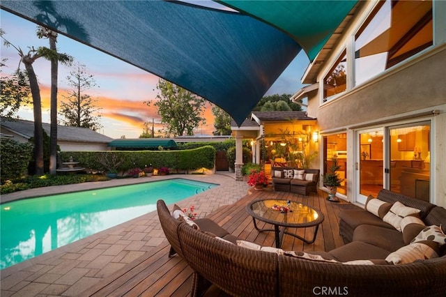 view of pool with a fenced in pool, a fenced backyard, a patio area, and outdoor lounge area