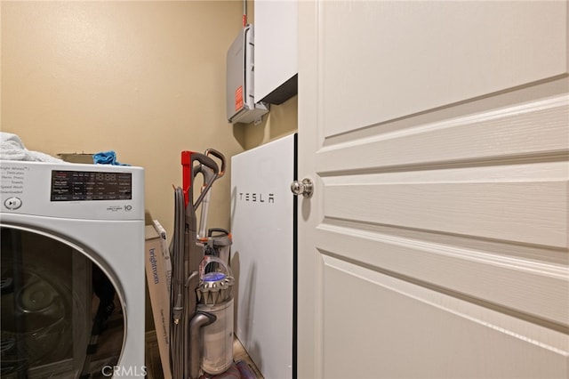 clothes washing area featuring laundry area and washer / dryer