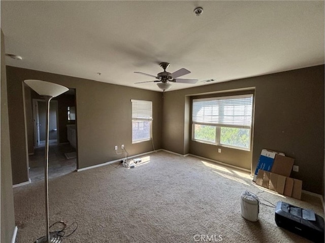 9133 Arbol Del Rosal Way Unit 230, Atascadero, CA 93422 - unfurnished bedroom with arched walkways, carpet, and a ceiling fan