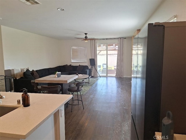 1361 Crown Imperial Ln, Beaumont, CA 92223 - living area featuring a ceiling fan, visible vents, and dark wood-style floors