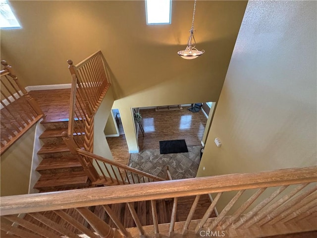 staircase featuring baseboards