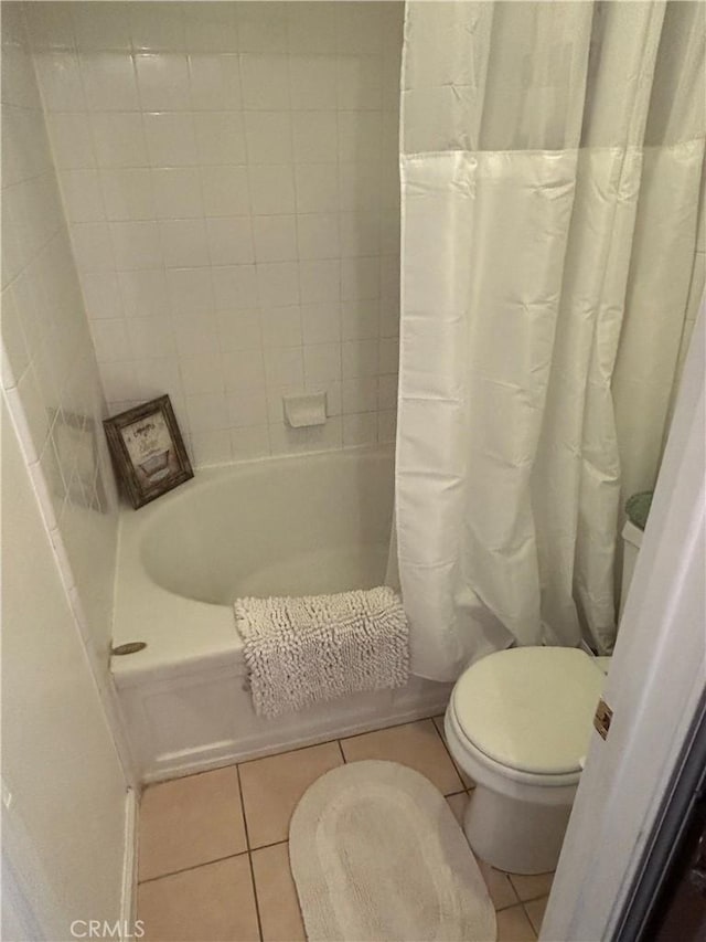 343 San Bernardino St, Los Banos, CA 93635 - full bath featuring toilet, tile patterned flooring, and shower / bathtub combination with curtain