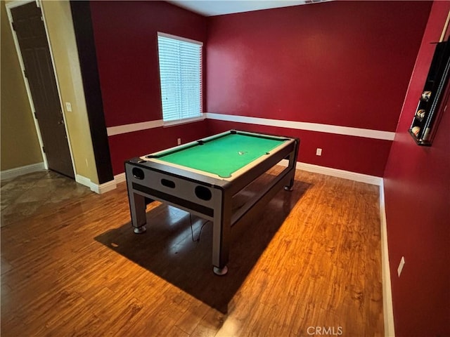 playroom featuring baseboards, wood finished floors, and pool table