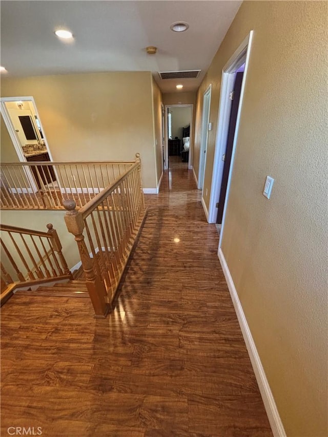 343 San Bernardino St, Los Banos, CA 93635 - hall with an upstairs landing, wood finished floors, baseboards, and recessed lighting