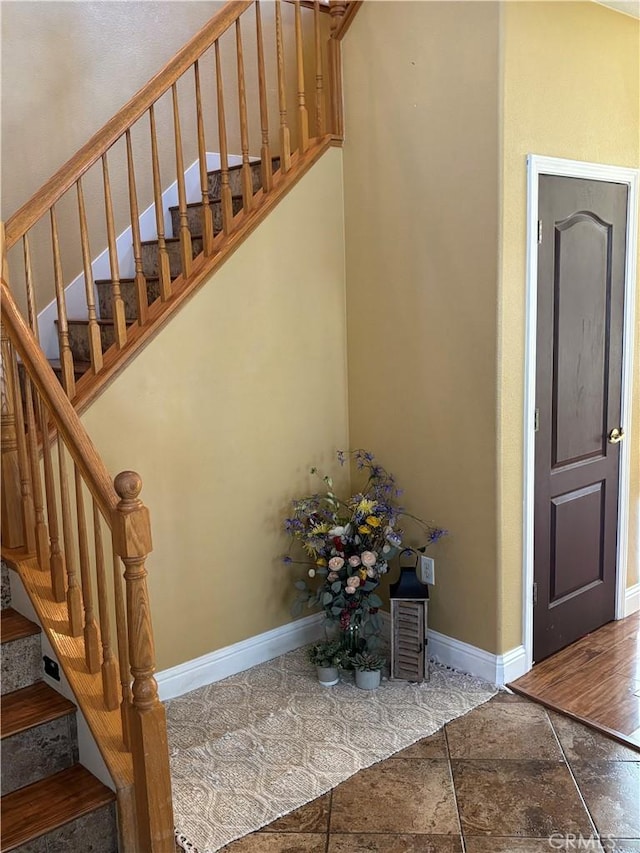 stairs featuring baseboards