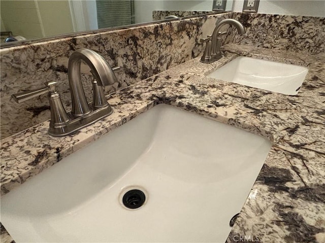 room details with decorative backsplash and a sink