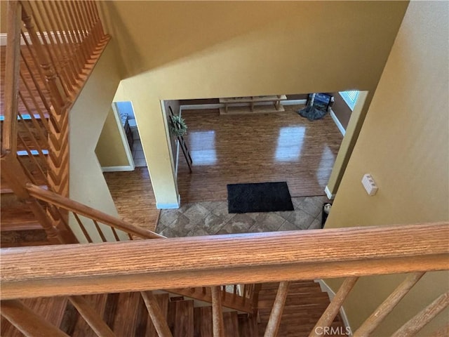 343 San Bernardino St, Los Banos, CA 93635 - stairs with baseboards and wood finished floors