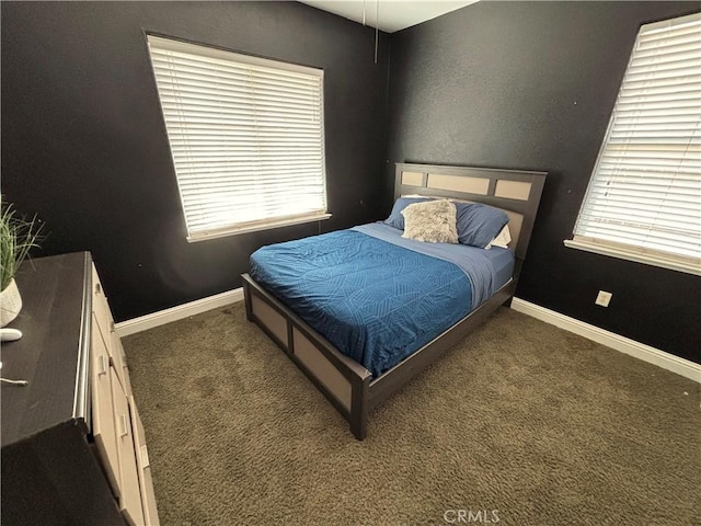 carpeted bedroom with baseboards