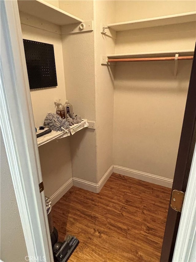 spacious closet featuring wood finished floors