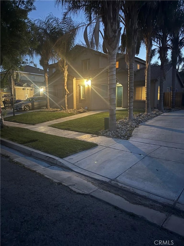 343 San Bernardino St, Los Banos, CA 93635 - view of front of home with a front lawn and stucco siding