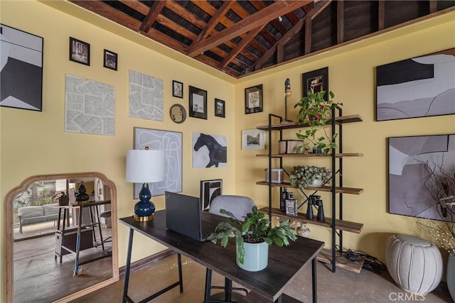 home office featuring vaulted ceiling with beams, concrete flooring, and wood ceiling