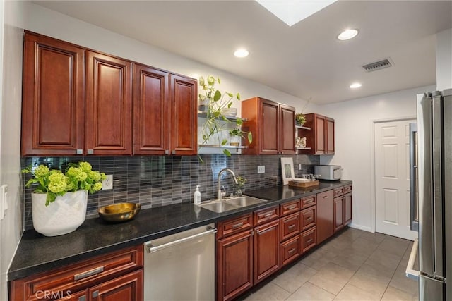 kitchen with open shelves, a sink, stainless steel appliances, tasteful backsplash, and visible vents