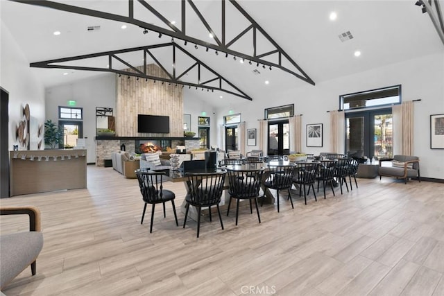 dining room with recessed lighting, high vaulted ceiling, and visible vents
