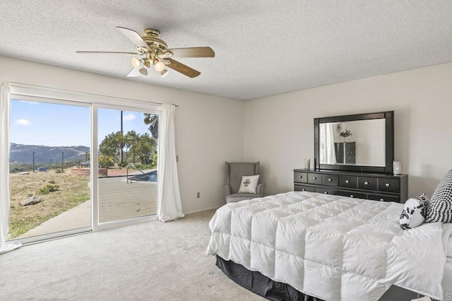 68256827 Kellyn Ln, Vista, CA 92084 - bedroom featuring access to outside, a textured ceiling, light colored carpet, and a mountain view