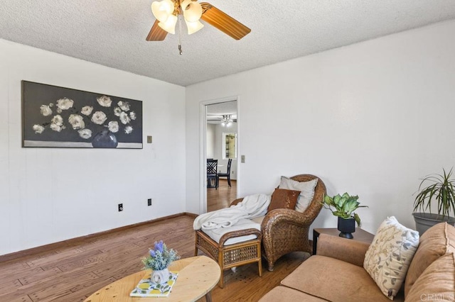 68256827 Kellyn Ln, Vista, CA 92084 - living room with baseboards, a ceiling fan, a textured ceiling, and wood finished floors