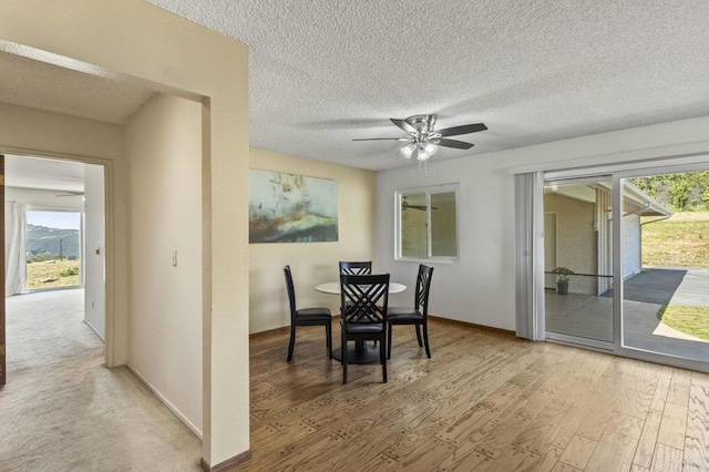 68256827 Kellyn Ln, Vista, CA 92084 - dining space featuring baseboards, a ceiling fan, light wood-type flooring, and a textured ceiling