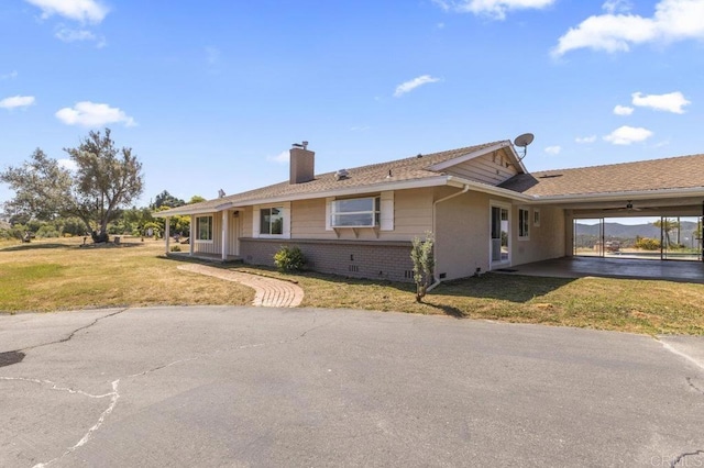 68256827 Kellyn Ln, Vista, CA 92084 - ranch-style home with brick siding, an attached carport, a front yard, and a chimney