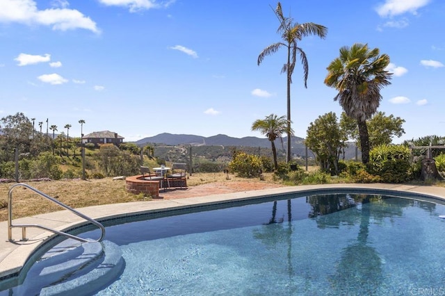 68256827 Kellyn Ln, Vista, CA 92084 - outdoor pool with a fire pit, a mountain view, and a patio area