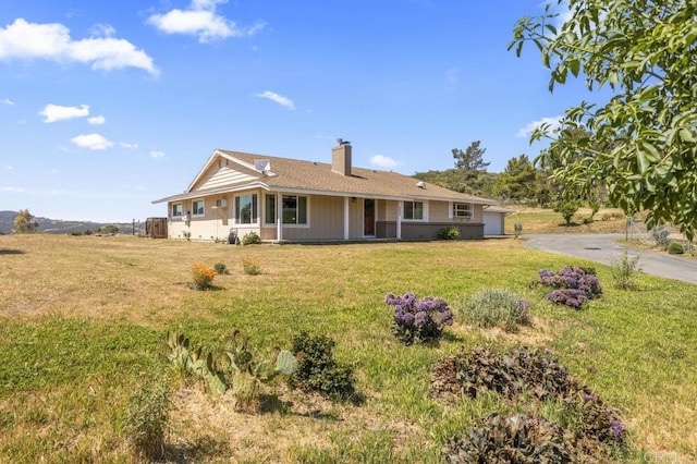 68256827 Kellyn Ln, Vista, CA 92084 - view of front of house featuring driveway, a chimney, and a front lawn