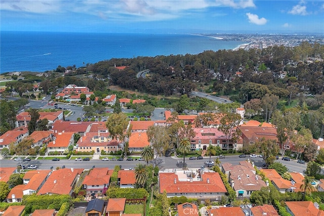 birds eye view of property featuring a water view and a residential view