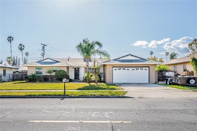 ranch-style home with concrete driveway, an attached garage, fence, and stucco siding