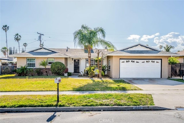 ranch-style home with a garage, a front lawn, and stucco siding