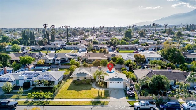 drone / aerial view with a residential view and a mountain view