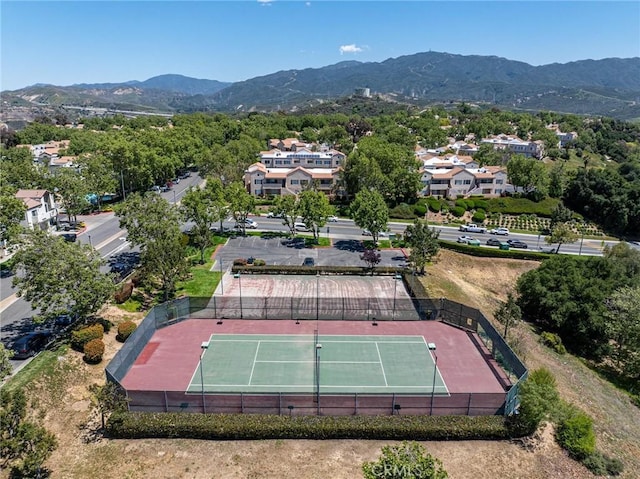 birds eye view of property with a mountain view