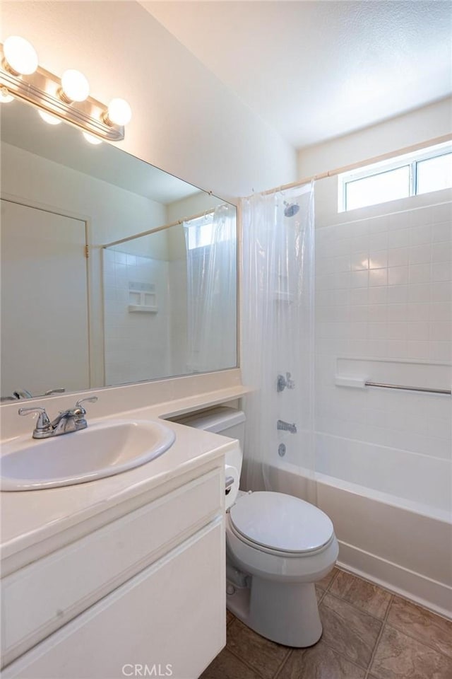 bathroom featuring vanity, tile patterned floors, shower / bath combination with curtain, and toilet