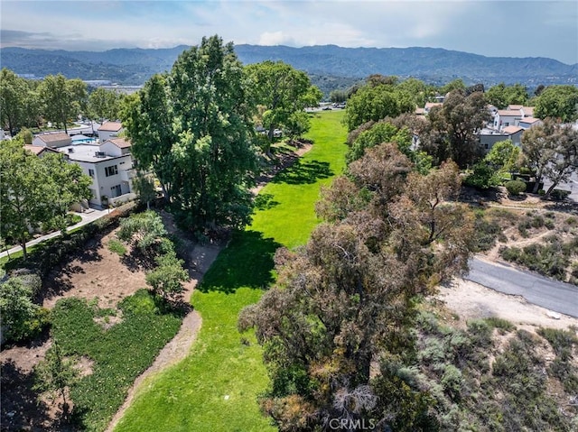 birds eye view of property with a mountain view