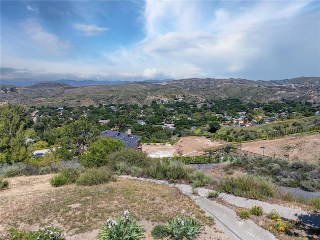 drone / aerial view featuring a mountain view