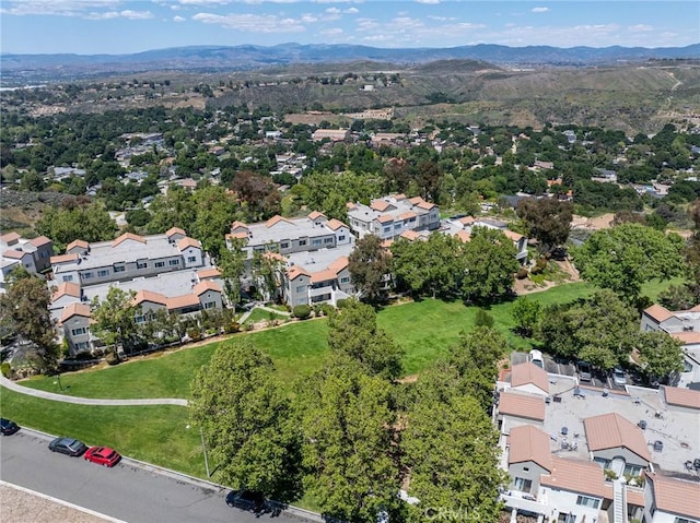 drone / aerial view featuring a mountain view