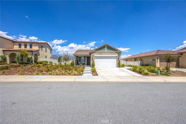 ranch-style home with stucco siding, driveway, and a garage