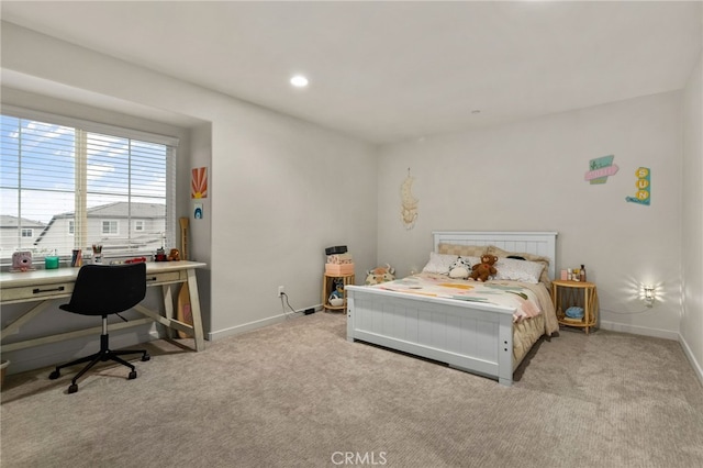 carpeted bedroom featuring baseboards