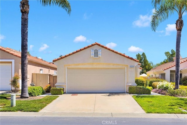 40684 Corte Albara, Murrieta, CA 92562 - mediterranean / spanish-style house featuring a garage, stucco siding, driveway, and a tile roof