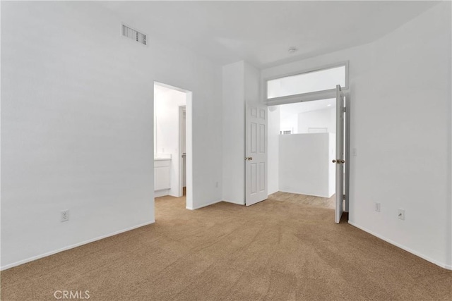 40684 Corte Albara, Murrieta, CA 92562 - unfurnished bedroom featuring baseboards, carpet, connected bathroom, and visible vents