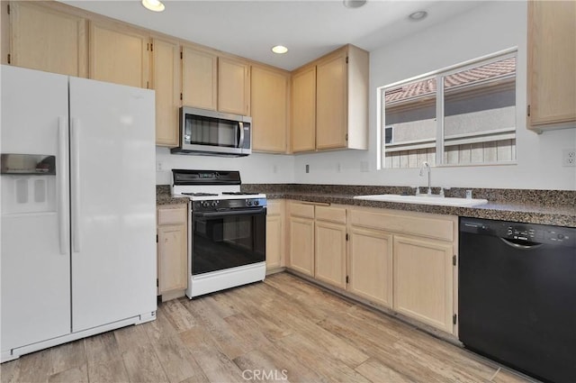 40684 Corte Albara, Murrieta, CA 92562 - kitchen with white refrigerator with ice dispenser, stainless steel microwave, light brown cabinets, black dishwasher, and gas range oven
