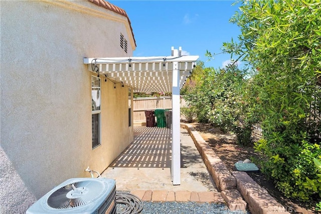 40684 Corte Albara, Murrieta, CA 92562 - view of patio / terrace featuring fence, a pergola, and central AC unit