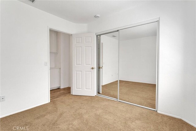 40684 Corte Albara, Murrieta, CA 92562 - unfurnished bedroom featuring carpet floors and a closet