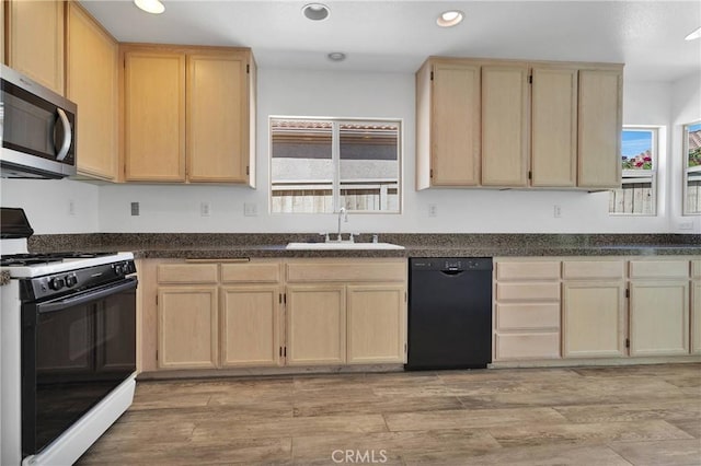 40684 Corte Albara, Murrieta, CA 92562 - kitchen featuring light brown cabinets, black dishwasher, stainless steel microwave, a sink, and gas stove
