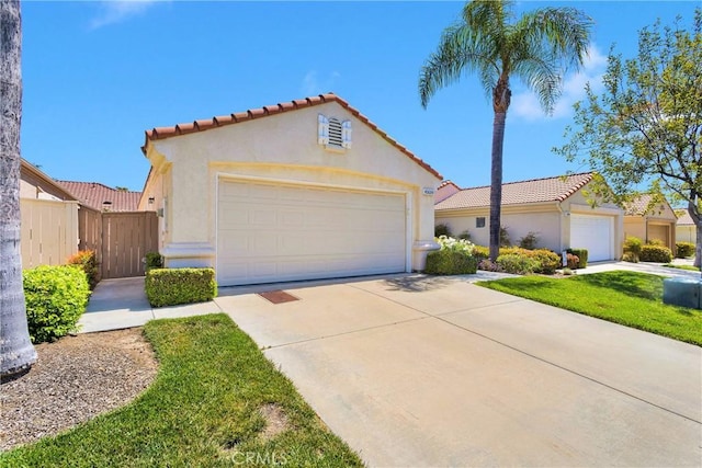 40684 Corte Albara, Murrieta, CA 92562 - mediterranean / spanish-style house with a tiled roof, fence, driveway, and stucco siding