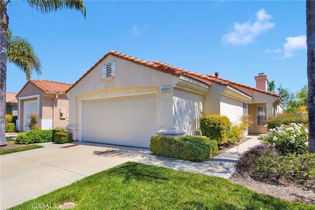 40684 Corte Albara, Murrieta, CA 92562 - mediterranean / spanish home featuring an attached garage, stucco siding, driveway, and a tile roof
