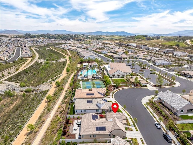 drone / aerial view featuring a residential view and a mountain view