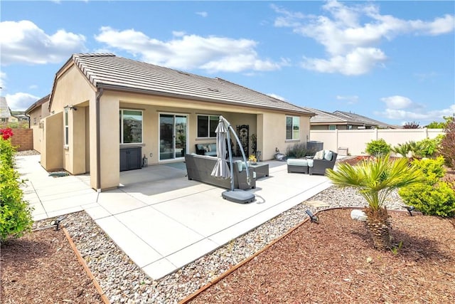 32148 Sedge Way, Temecula, CA 92591 - back of house featuring an outdoor hangout area, stucco siding, fence, and a tiled roof