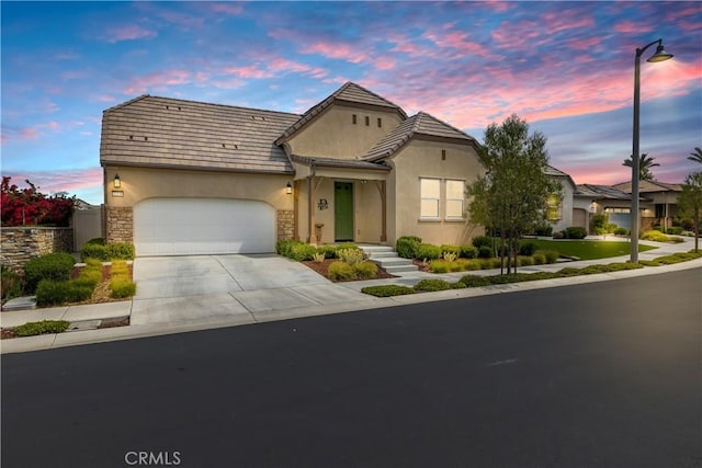 32148 Sedge Way, Temecula, CA 92591 - view of front of house with a garage, concrete driveway, stucco siding, and stone siding