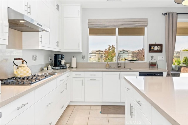 32148 Sedge Way, Temecula, CA 92591 - kitchen featuring a sink, under cabinet range hood, light tile patterned flooring, and plenty of natural light