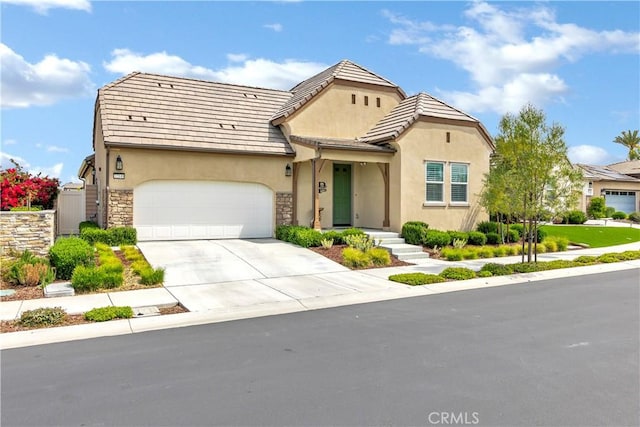 32148 Sedge Way, Temecula, CA 92591 - view of front facade featuring stucco siding, an attached garage, driveway, stone siding, and a tiled roof
