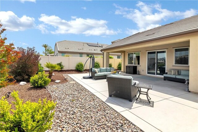 view of patio with a fenced backyard and outdoor lounge area